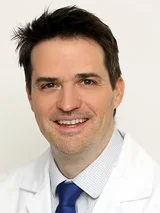 Keith Vossel, MD, MSc, male, smiling for a professional portrait.