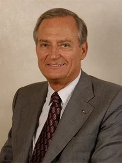 Mr. Jim Easton, a classy gentleman, smiling for a professional portrait.