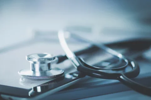 stethoscope and table on white background