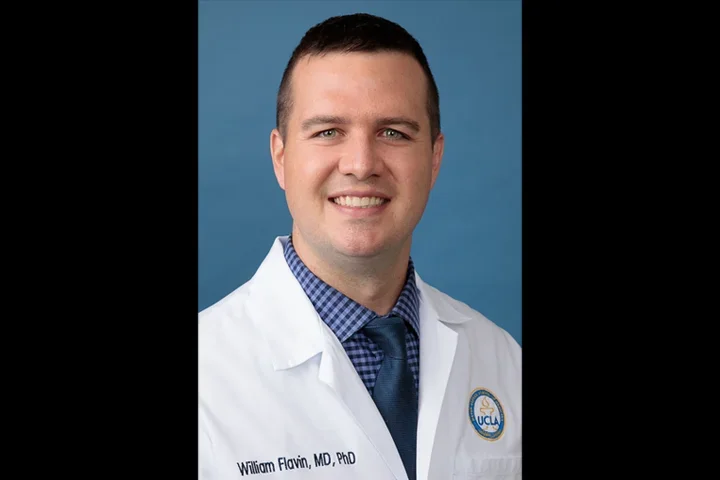 Dr. William Flavin - neurologist in white coat