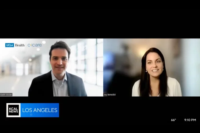 a male being interviewed virtually by a female host.