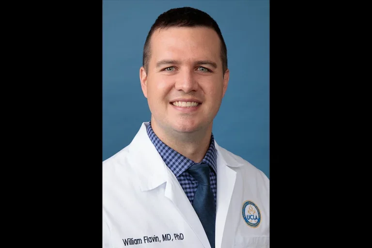 Dr. William Flavin - neurologist in white coat