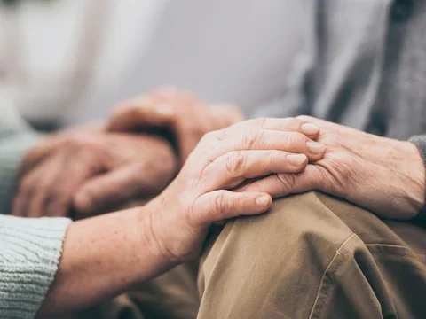 A couple holding hands - image for LBD Caregiver Support Group