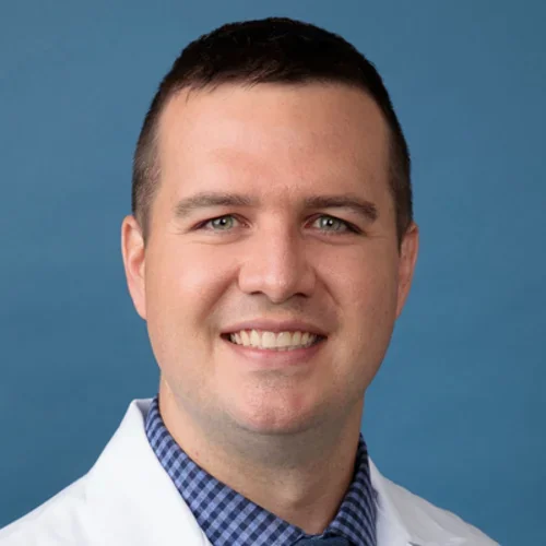 Dr. William Flavin - neurologist in white coat