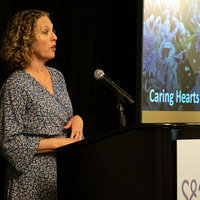 Monica Moore presenting the Caring Hearts Award at the Alzheimer's Lols Angeles Visionary Women’s Tea.